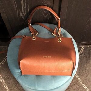Calvin Klein reversible bag with gold hardware.